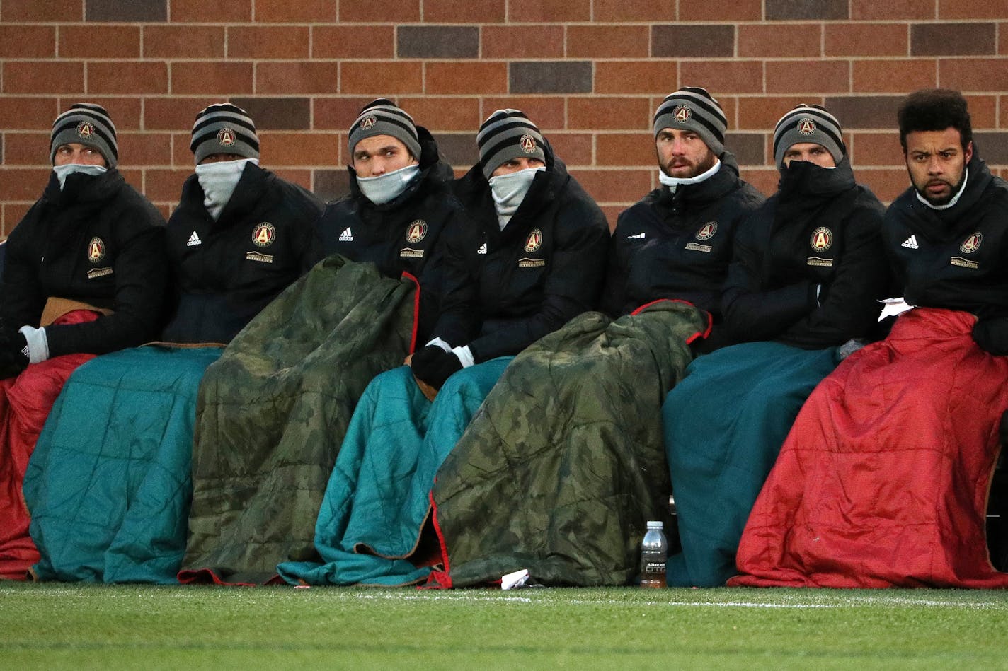 Atlanta United players sat bundled up in blankets on the sidelines in the first half Saturday night at TCF Bank Stadium.