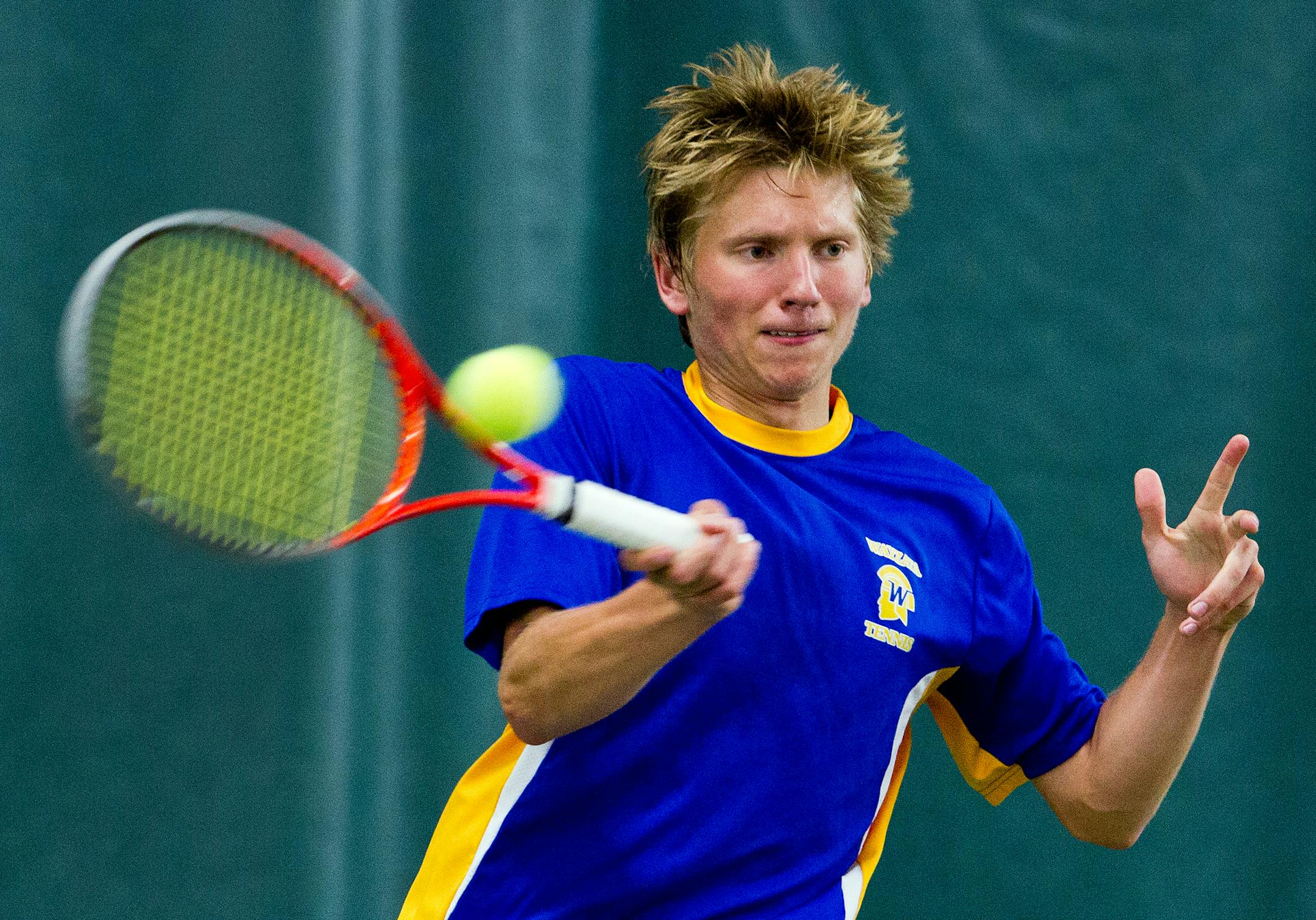 Wayzata's Dustin Britton hits the ball in the Wayzata vs. Minnetonka Class AA boys state tennis team finals at the U of M Baseline Tennis Center in Minneapolis, Minn., on Wednesday, June 4, 2013. Wayzata swept the championship. ] (ANNA REED/STAR TRIBUNE) anna.reed@startribune.com