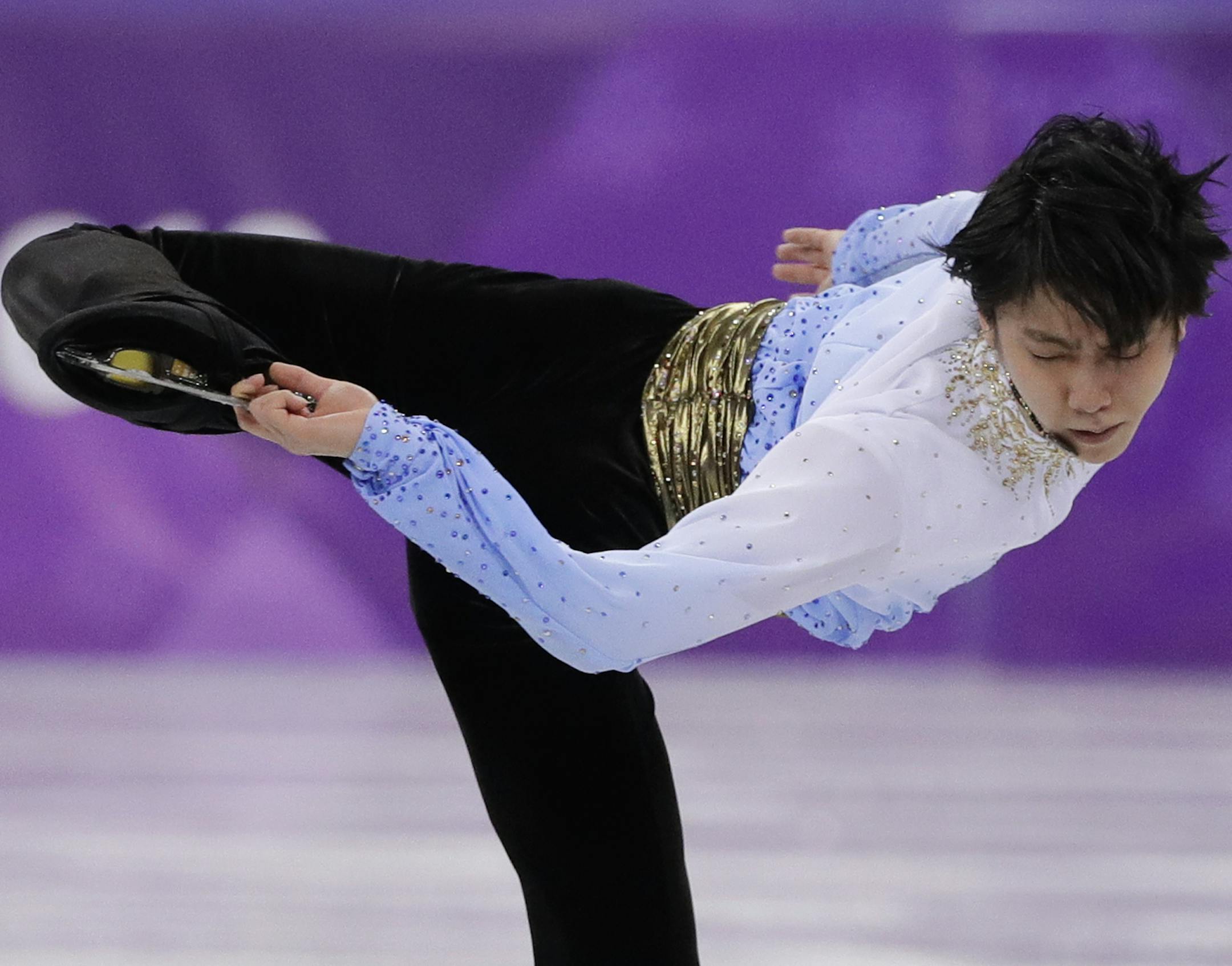 Yuzuru Hanyu of Japan performs during the men's short program figure skating in the Gangneung Ice Arena at the 2018 Winter Olympics in Gangneung, South Korea, Friday, Feb. 16, 2018. (AP Photo/David J. Phillip)