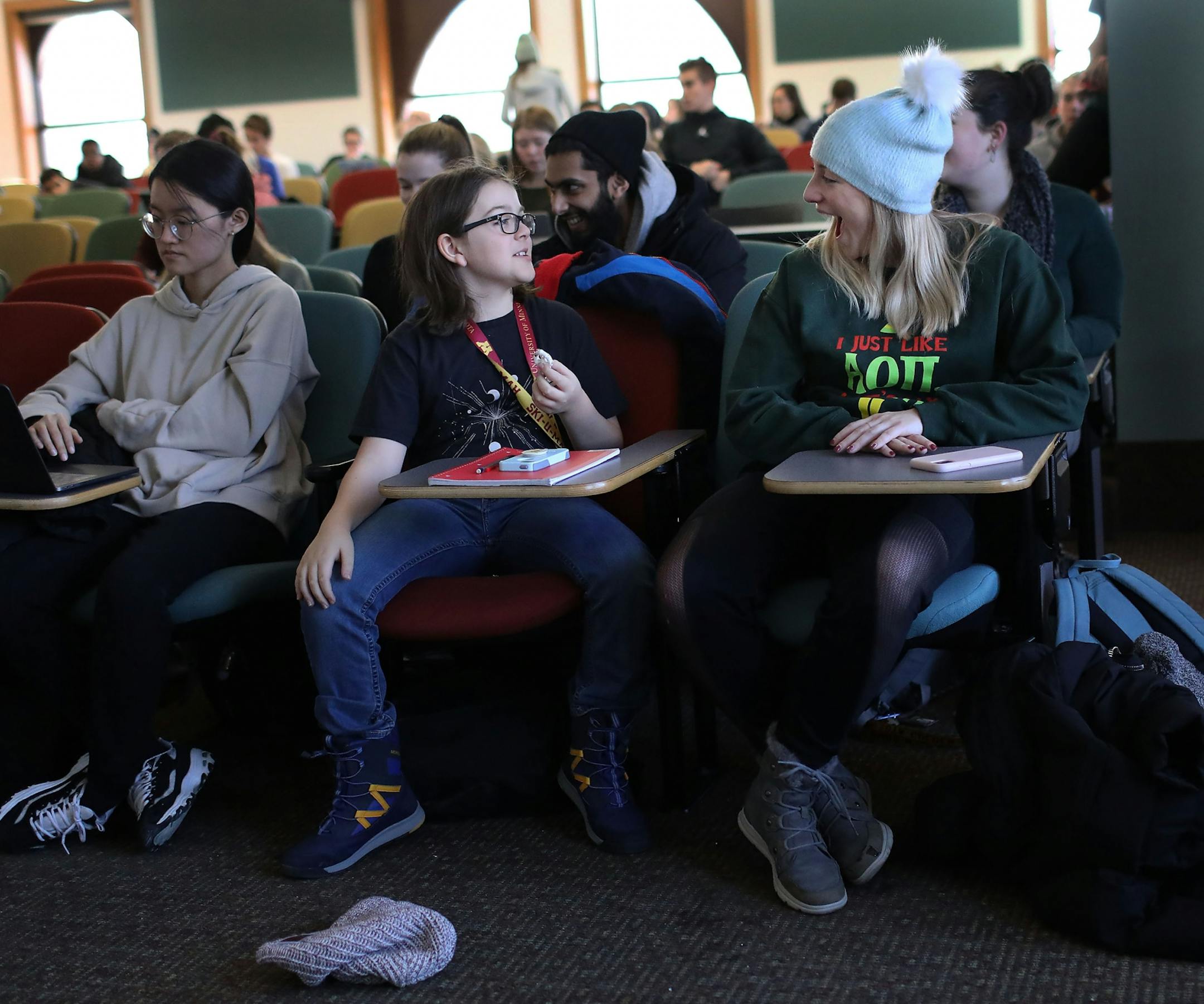 Elliott Tanner, 11, chats with classmate Emma Gordon before the start of their Earth and Environment class.
