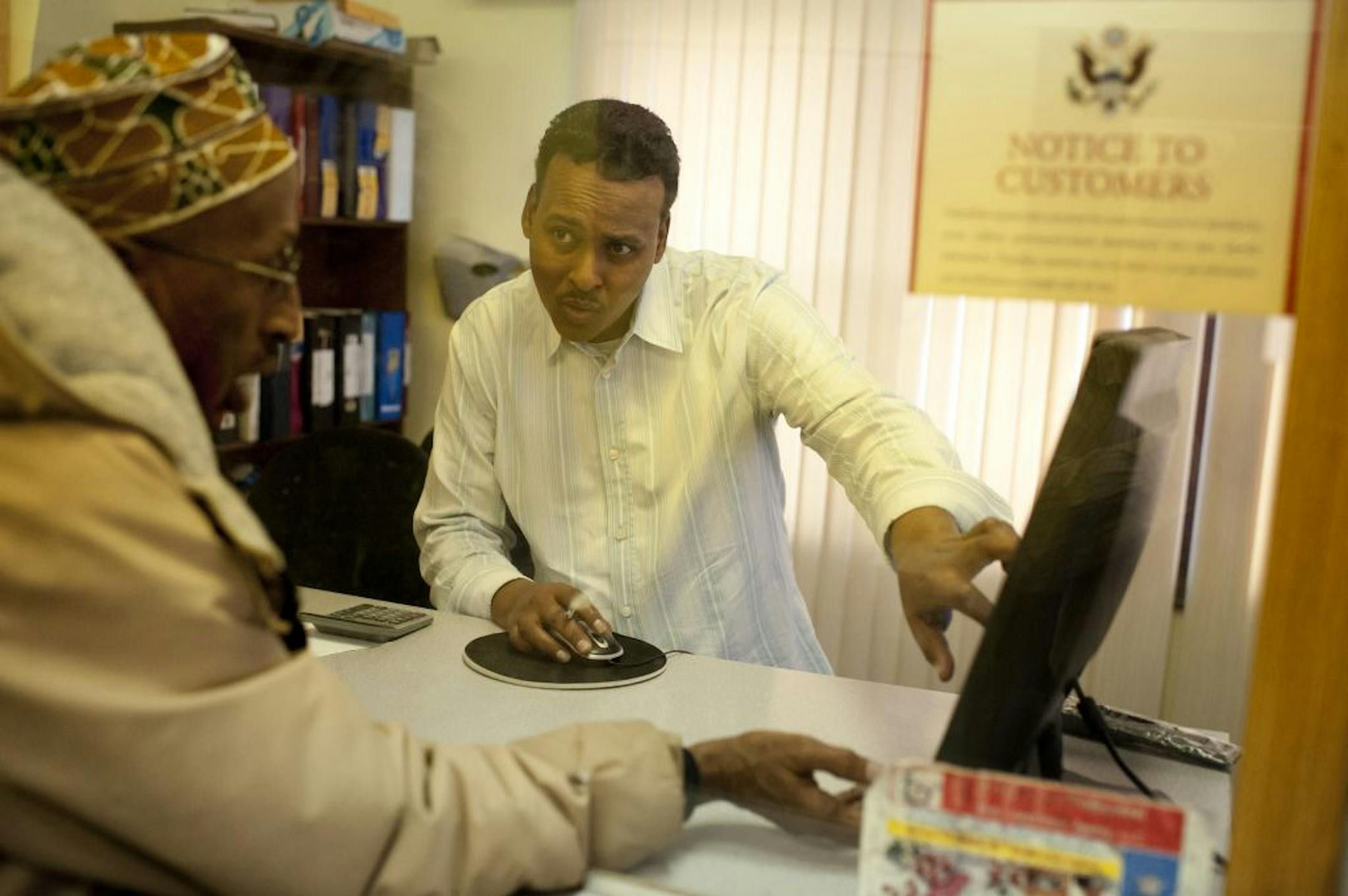 Ahmed Elmi, compliance officer at Amaana Money Transfer in Minneapolis, transferred money to Somalia for Mohamed Nurmohame on Friday.