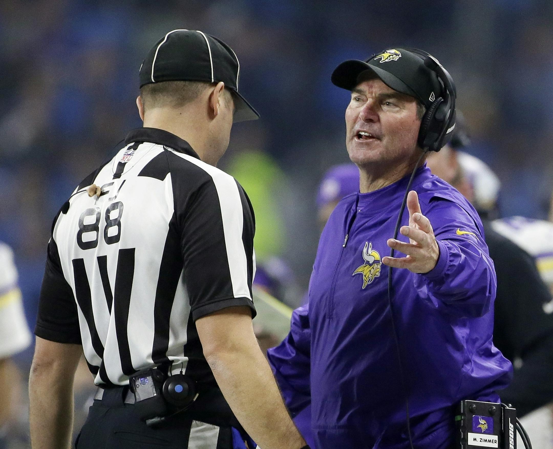 Minnesota Vikings head coach Mike Zimmer talks with field judge Brad Freeman during the second half of an NFL football game against the Detroit Lions, Thursday, Nov. 24, 2016 in Detroit. (AP Photo/Duane Burleson)