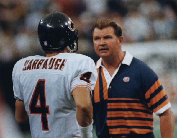 Chicago Bear's Mike Ditka had a few choice words for QB Jim Harbaugh after his fourth-quarter interception was returned for a TD. PHOTO Star Tribune J