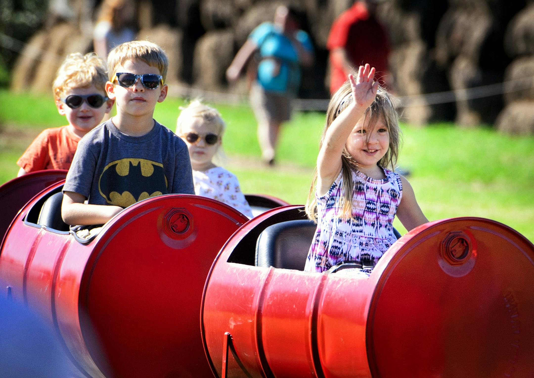Norah BuBois, 3, waved to her dad Mike as she rode aboard the Honeycrisp Express at Aamodt's Apple Farm, Stillwater. ] GLEN STUBBE * gstubbe@startribune.com Sunday September 27, 2015 This year is considered a particularly good year for apples by the Minnesota Apple Growers Association. They say that everything is ripening about a week earlier than usual. Here at Aamodt's Apple Farm, Stillwater, Pick Your Own Apples is done for the season.