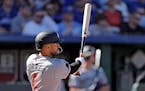 The Twins' Carlos Correa slugged an RBI double during the third inning against the Royals on Opening Day in Kansas City on Thursday.