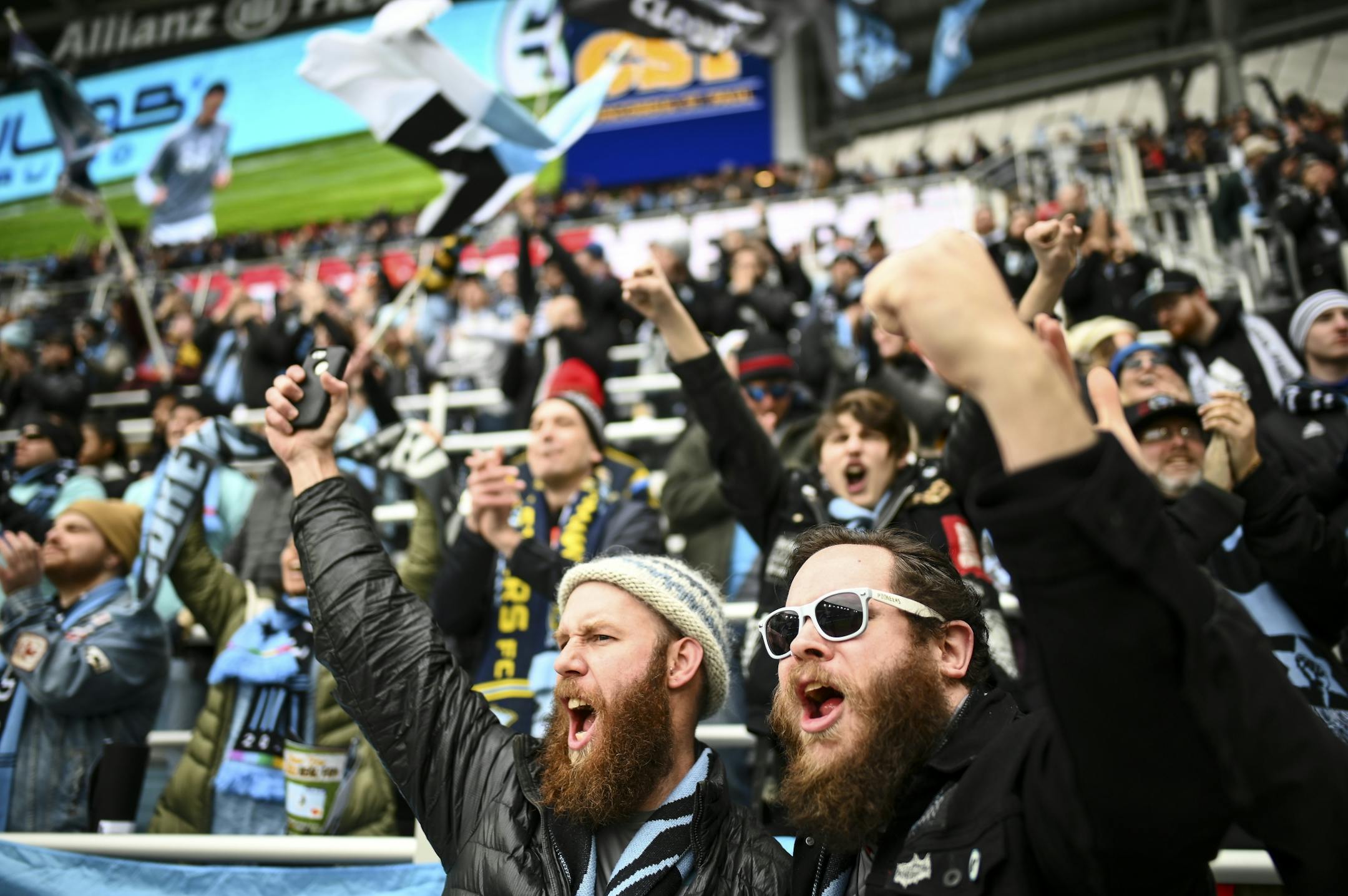 Minnesota United supporters Eric Stevens, left, from Mississippi, and Dan Vitale, of Seattle, cheered as their team took the field for warmups Saturday.