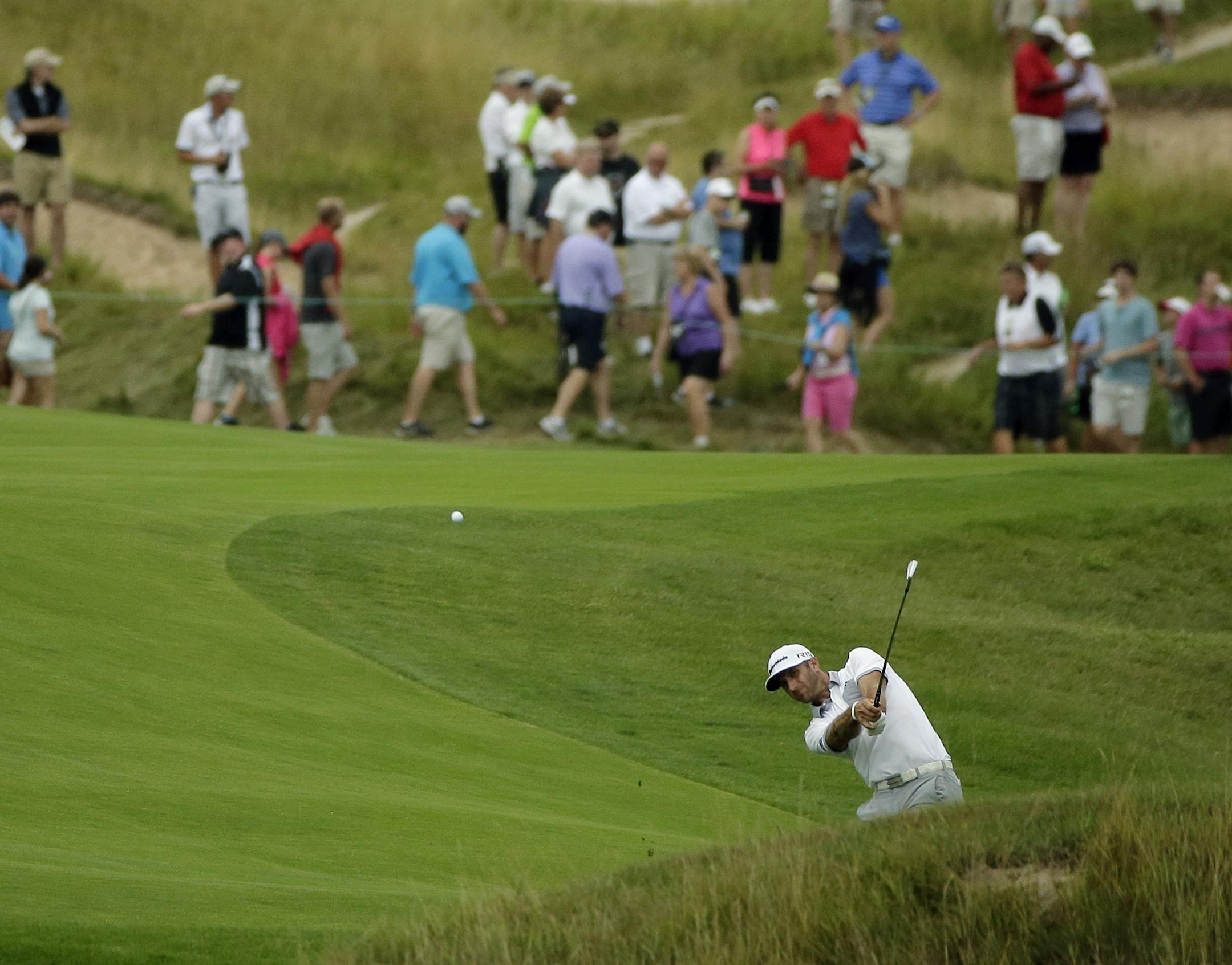 Dustin Johnson hits to the 18th hole during the first round of the PGA Championship golf tournament Thursday, Aug. 13, 2015, at Whistling Straits in Haven, Wis. (AP Photo/Chris Carlson)