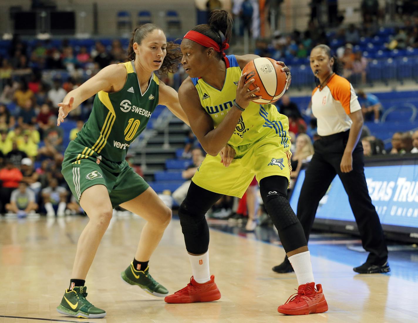 Seattle Storm guard Sue Bird (10) defends as Dallas Wings guard Karima Christmas-Kelly looks for an opening to the basket in the second half of a WNBA basketball game, Friday, Aug. 4, 2017, in Arlington, Texas. (AP Photo/Tony Gutierrez) ORG XMIT: OTKTG107