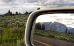 FILE &#xf3; The Teton Range reflected in the rear-view mirror during a road trip through Wyoming, June 16, 2015. Drivers should make sure their vehicl