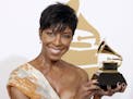 FILE - In a Sunday, Feb. 8, 2009 file photo, Natalie Cole holds the best instrumental arrangement accompanying vocalist award backstage at the 51st An