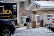 Police and the BCA at the scene where two people were shot and killed Monday night at a Super 8 hotel in Cloquet, Minn., on Tuesday, Jan. 9, 2024. ] E