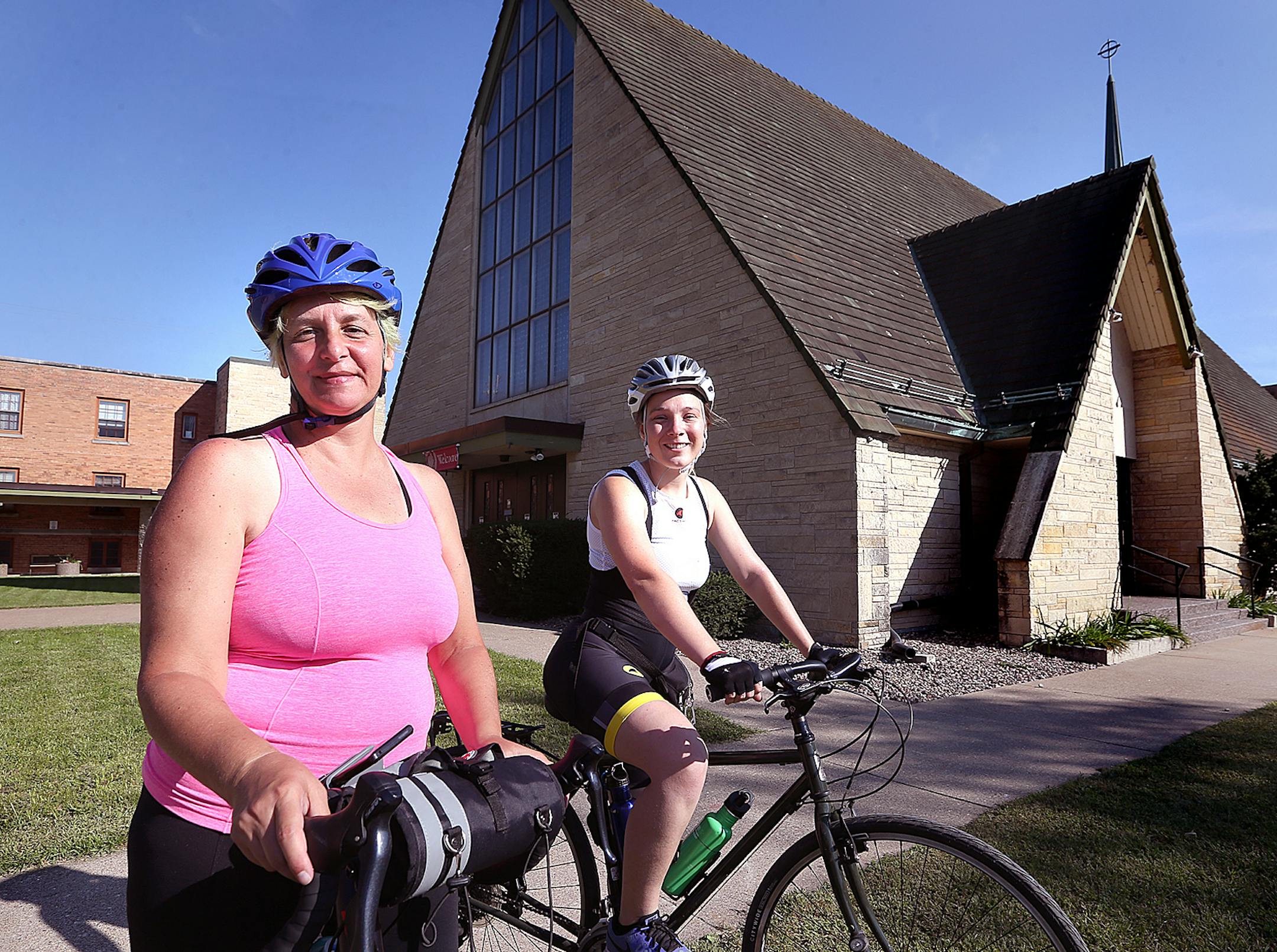 Pastor Melissa Melnik of Minneapolis, left, photographed with friend Shannon Coyne at Our Saviors Lutheran Church, has embarked on a 1,500-mile bike ride in memory of her son, Chris Stanley, who was planning to take the same route but drowned to death in the Mississippi River before having the chance.