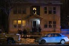 Police officers stood outside while investigators began their work on the second floor of a building in the 2000 block of Portland Ave. S. Sunday nigh