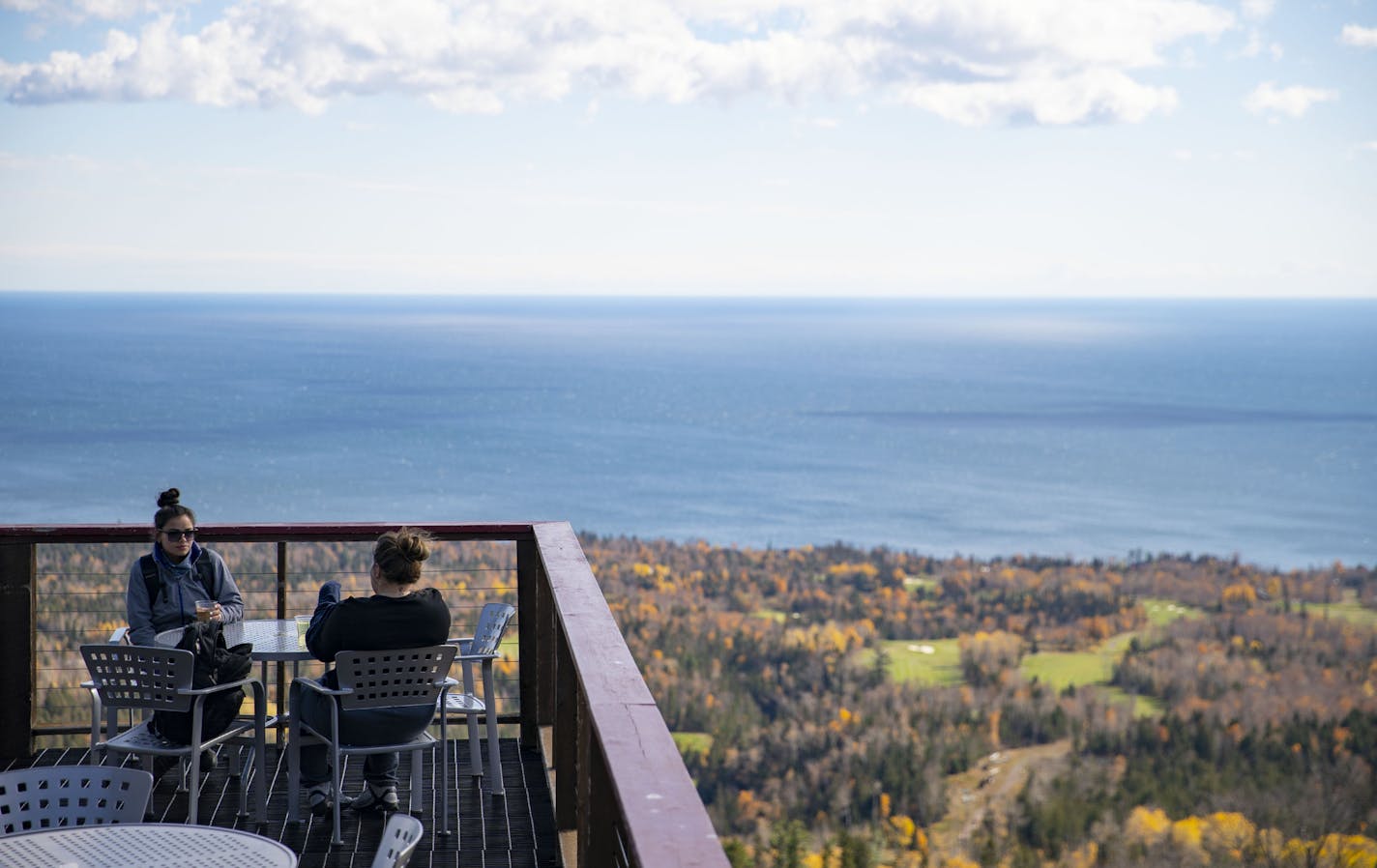 Visitors enjoyed drinks at the Summit Chalet on top of Moose Mountain in Lutsen, Minn. on Tuesday. ] ALEX KORMANN • alex.kormann@startribune.com A busy summer has translated to a busy fall at North Shore resorts - and winter is looking promising too. This trend includes Caribou Highlands in Lutsen, Minn.