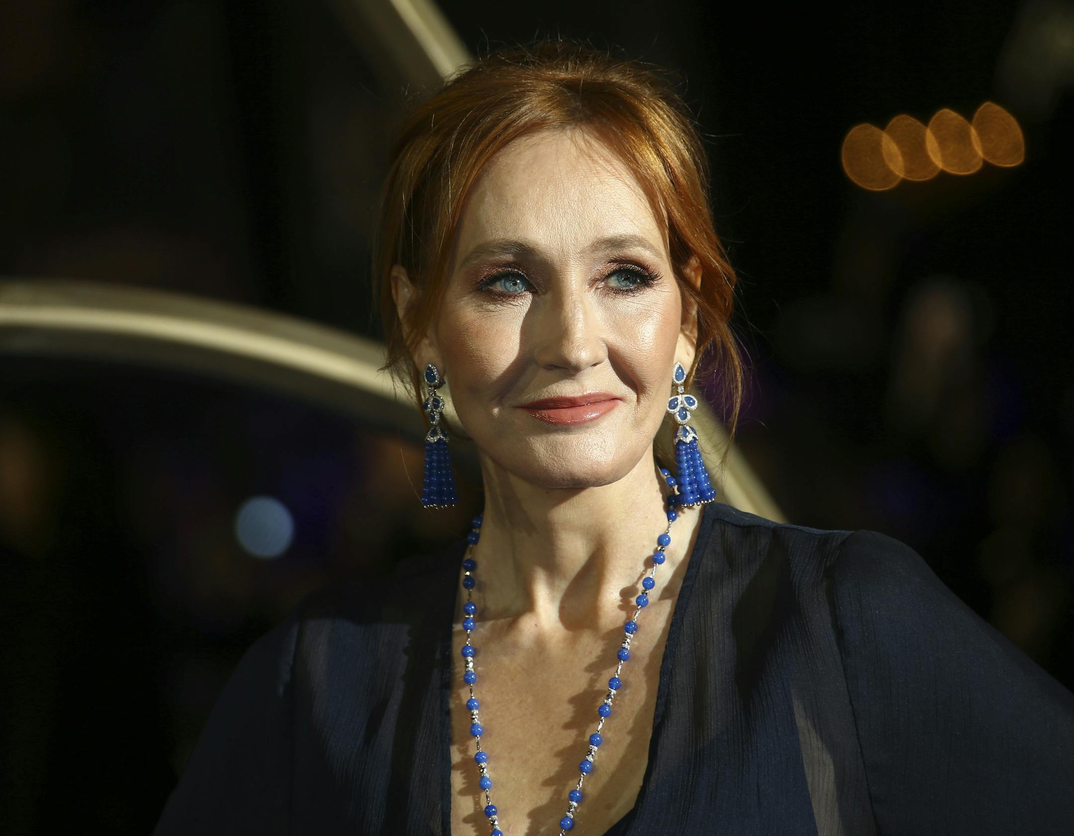 FILE - In this Nov. 13, 2018 file photo, author J.K. Rowling poses for photographers upon her arrival at the premiere of the film 'Fantastic Beasts: The Crimes of Grindelwald', in London. JK Rowling is publishing a new story called "The Ickabog," which will be free to read online to help entertain children and families stuck at home during the coronavirus pandemic. The "Harry Potter" author said Tuesday May 26, 2020, that she wrote the fairy tale for her children as a bedtime story over a decade