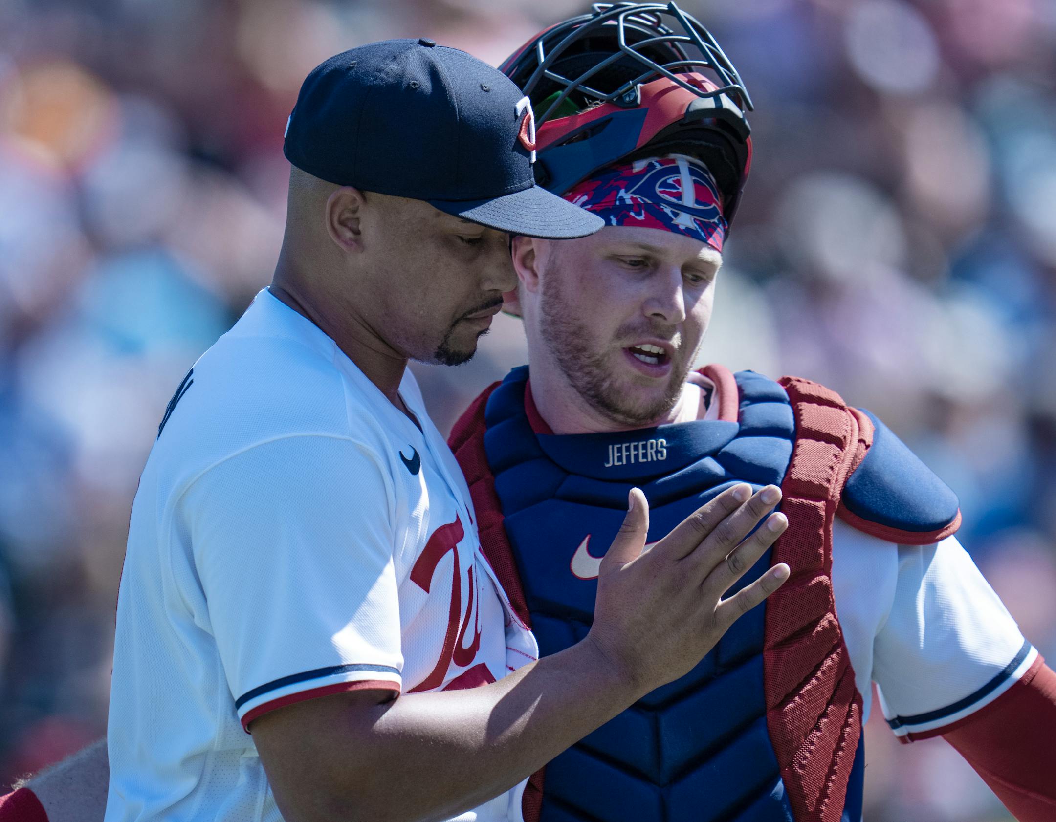 Minnesota Twins relief pitcher Jhoan Duran (59), left, hugged catcher Ryan Jeffers (27) after pitching in the second inning.