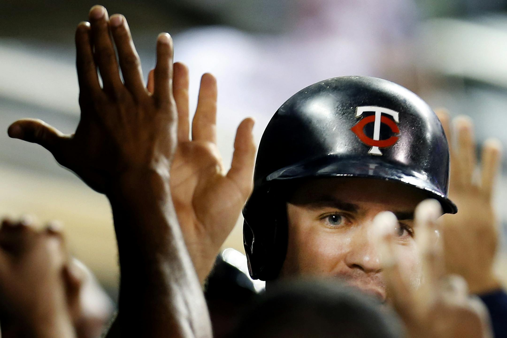 Minnesota Twins Joe Mauer (7) was congratulated by a teammates in the dugout after scoring in the eight inning. Minnesota beat Chicago by a final score of 7-5. ] CARLOS GONZALEZ cgonzalez@startribune.com June 18, 2013, Minneapolis, Minn., Target Field, MLB, Minnesota Twins vs. Chicago White Sox