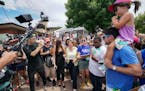 Sen. Amy Klobuchar was surrounded by reporters, photographers and fairgoers at the Iowa State Fair in Des Moines, Iowa.
