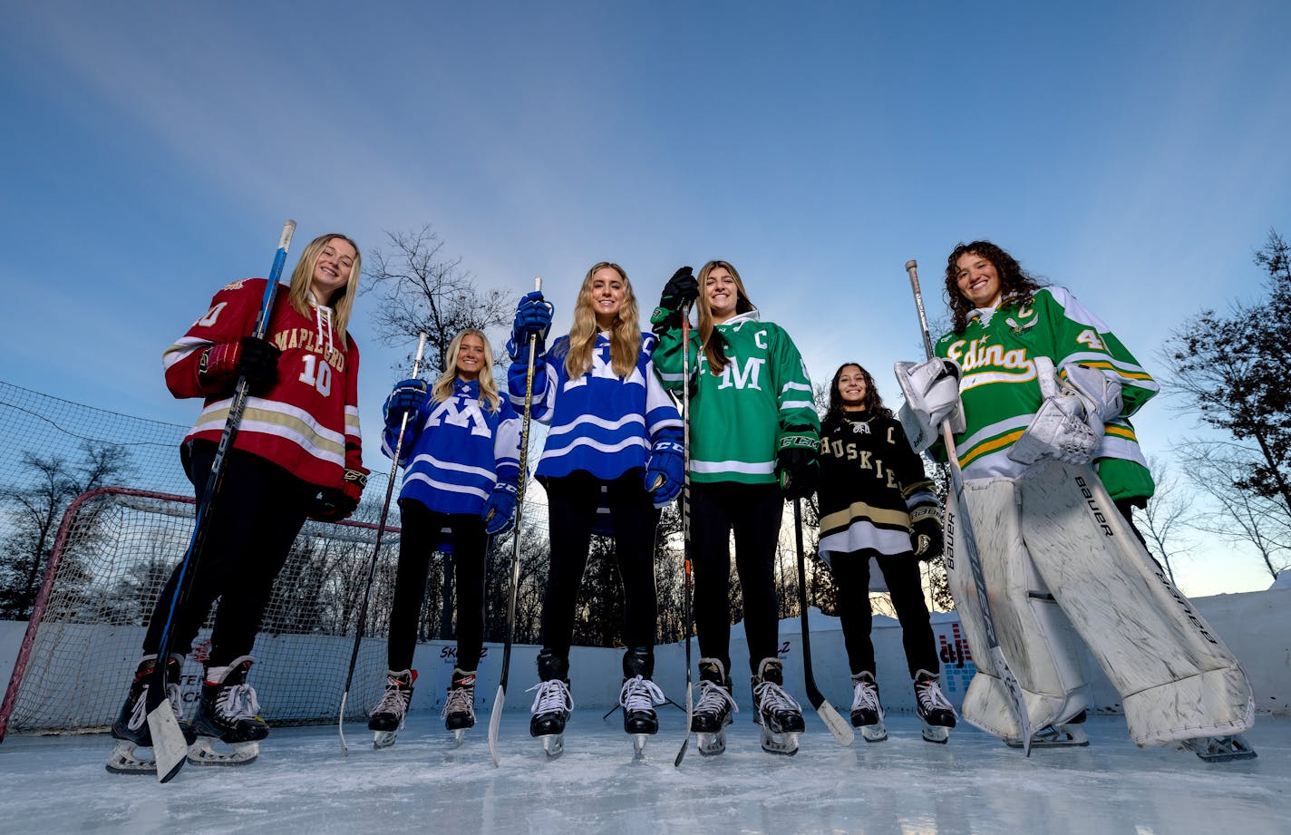 Stella Retrum (10) of Maple Grove, Josie Hemp (15) of Minnetonka, Ava Lindsay (9) of Minnetonka, Ellah Hause (8) of Hill Murray, Isa Goettl (12) of Andover and Uma Corniea (41) of Edina - All Metro Girls Hockey First Team players photographed Sunday, Jan. 29, 2023, in Circle Pines, Minn. ] CARLOS GONZALEZ • carlos.gonzalez@startribune.com.