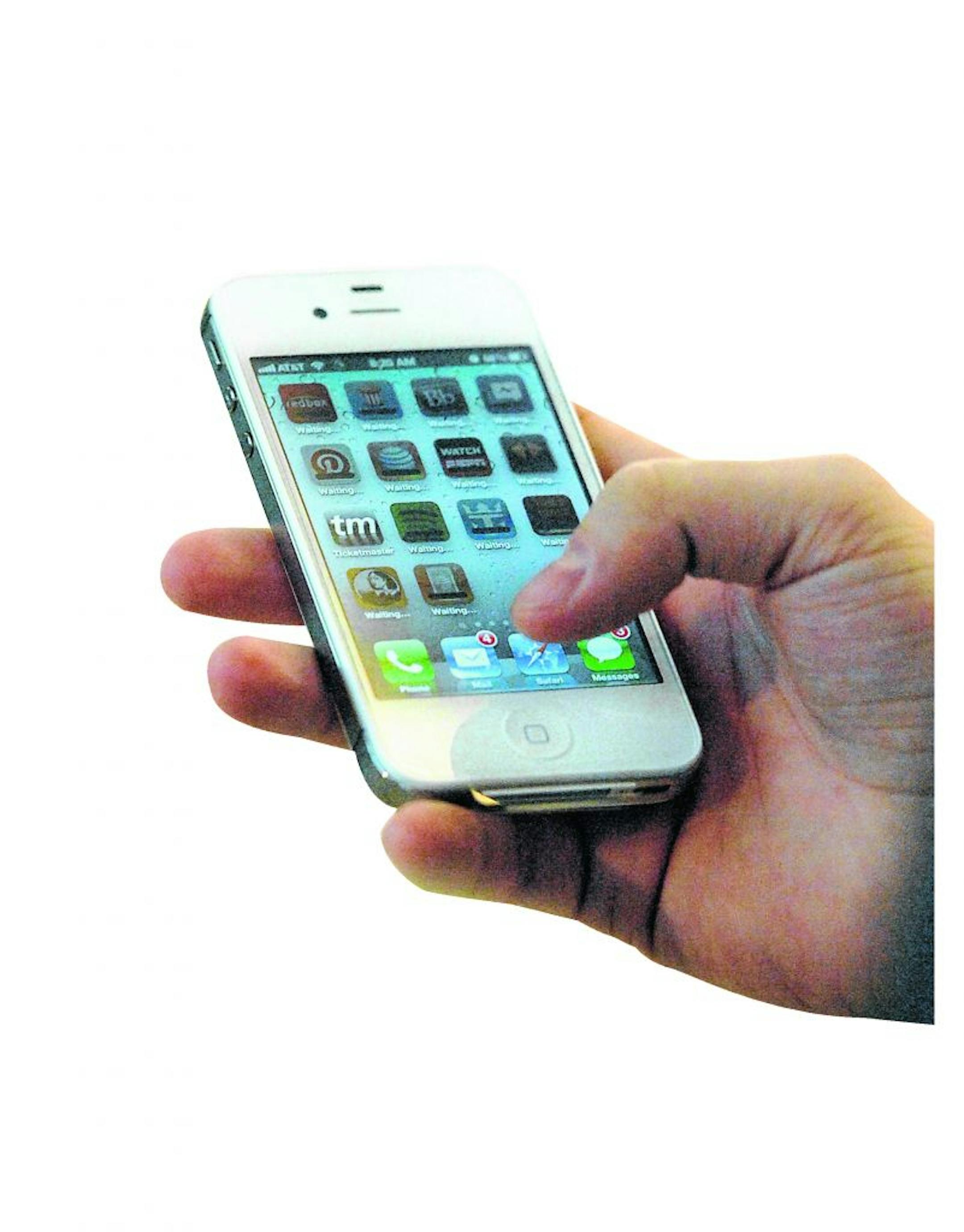 Eric Tesenair, who was first in line for the new iPhone 4S, tries out his new device at Northlake Mall, Friday, October 14, 2011, in Charlotte, North Carolina.