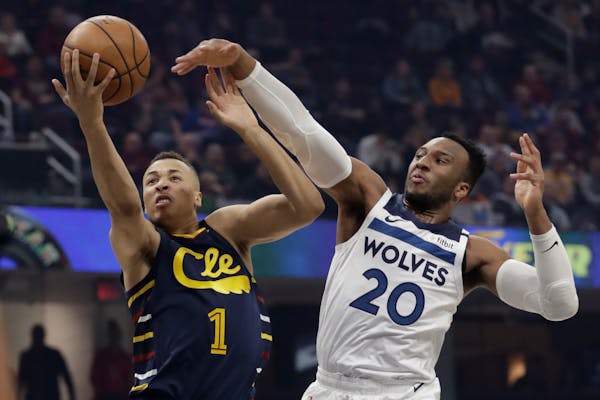 Cleveland Cavaliers' Dante Exum drives to the basket against the Timberwolves' Josh Okogie in the first half