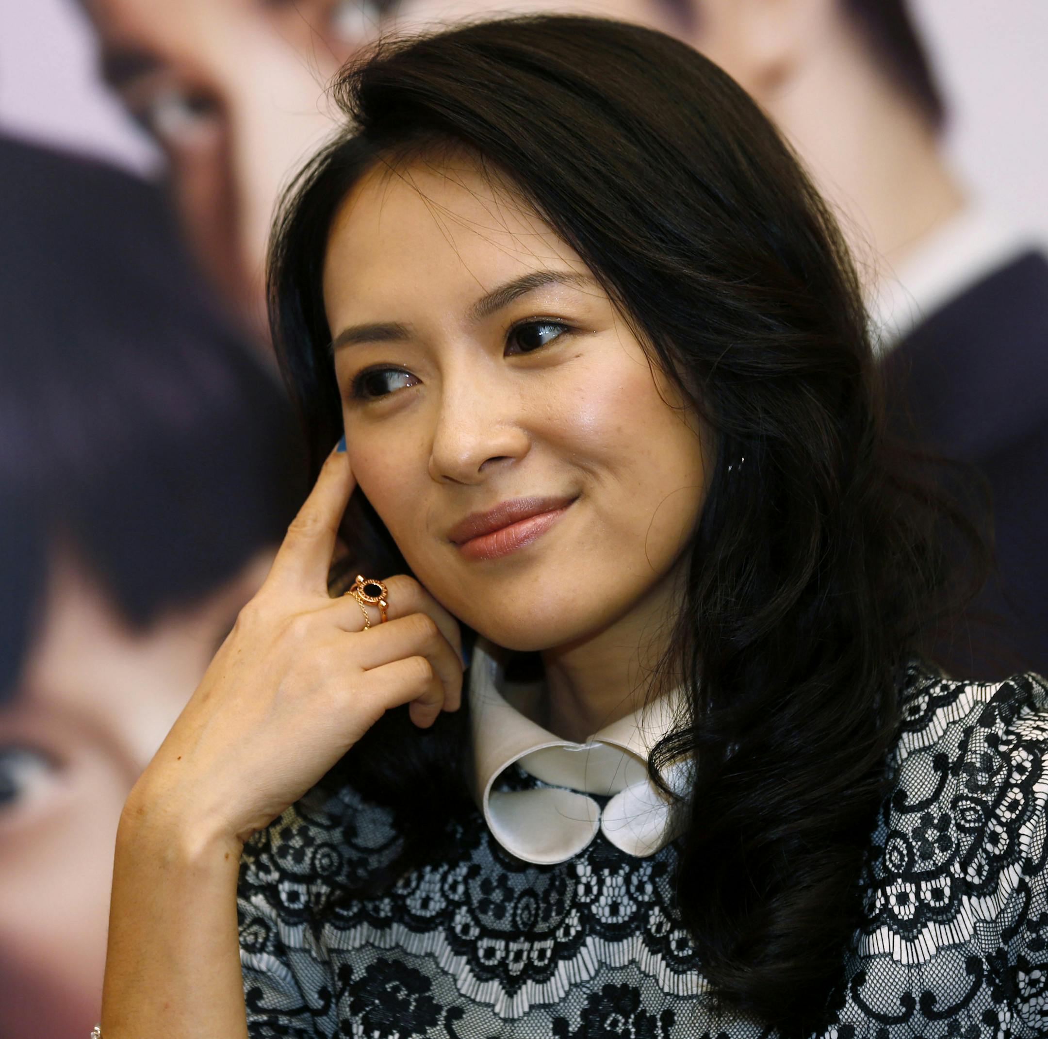 FILE - In this Sept, 12, 2013, file photo, Chinese actress Zhang Ziyi speaks to the media during a press conference to promote her movie "My Lucky Star" in Macau. Zhang posted a photo of a baby's hand online Monday, Dec. 28, 2015, to announce the arrival of her first child. Zhang's manager confirmed in a text message to The Associated Press that the 36-year-old actress had given birth following the post on the actress's Twitter-like Sina Weibo account. (AP Photo/Kin Cheung, File)