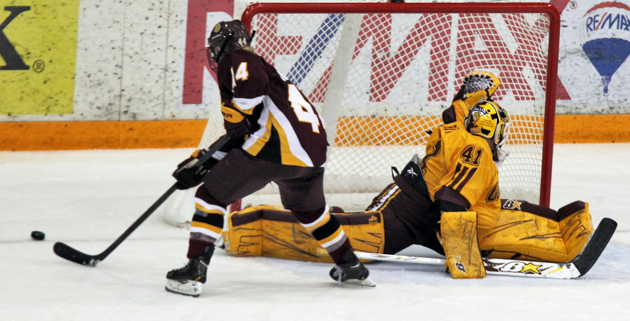 Minnesota Gophers vs. Minnesota--Duluth Bulldogs. Gophers goalie Noora Raty defended against a break-away goal shot attempt by Bulldogs Zoe Hickel (44). (MARLIN LEVISON/STARTRIBUNE(mlevison@startribune.com