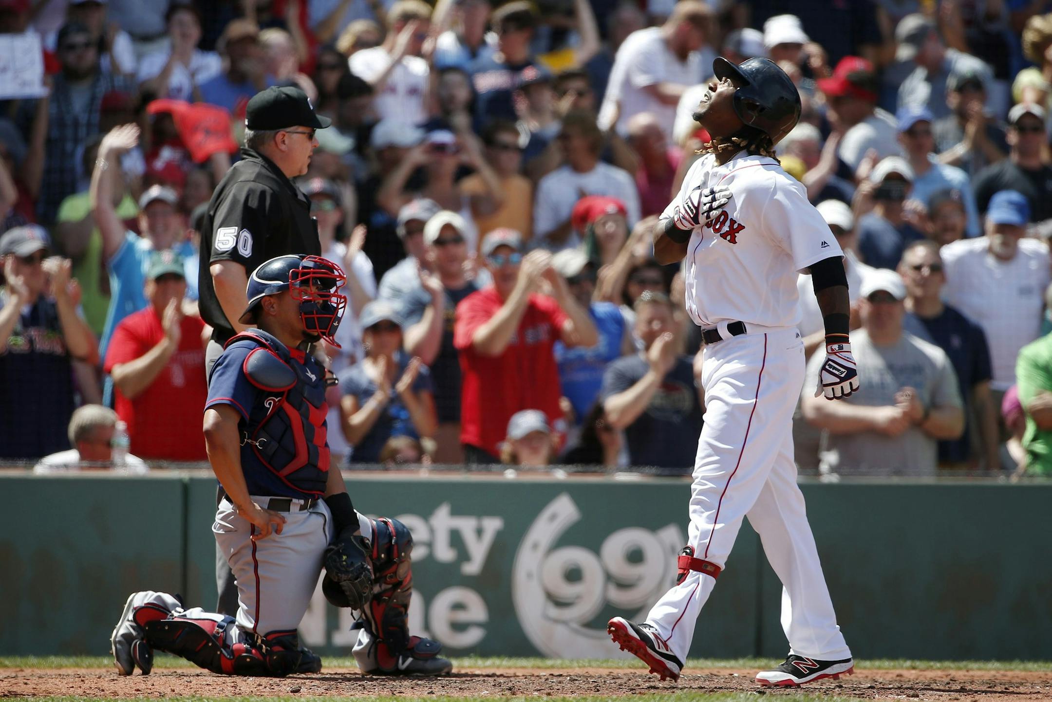 Boston Red Sox's Hanley Ramirez, right, celebrates his three-run home run in front of Minnesota Twins' Juan Centeno during the third inning of a baseball game in Boston, Sunday, July 24, 2016. (AP Photo/Michael Dwyer)