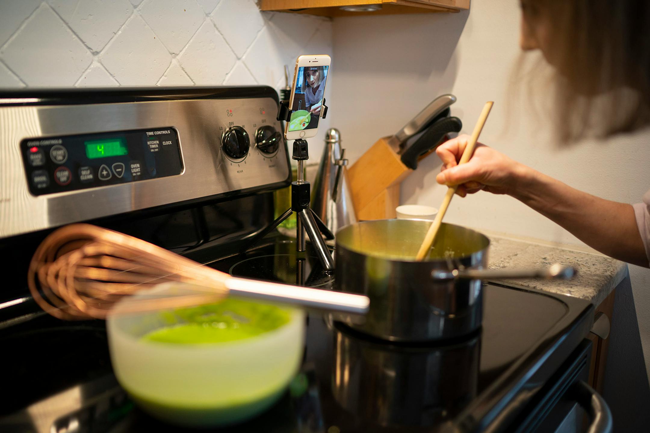 Chef Karyn Tomlinson addressed the camera while stirring the asparagus lee soup she demonstrated how to make for her Instagram show. Since the pandemic began, former Corner Table chef Karyn Tomlinson has been a prolific poster to Instagram, offering free cooking lessons with her show "Karyn's Quarantine Kitchen." She was photographed producing a segment on preparing pureed soups Thursday afternoon, April 23, 2020 in the kitchen of her condo.