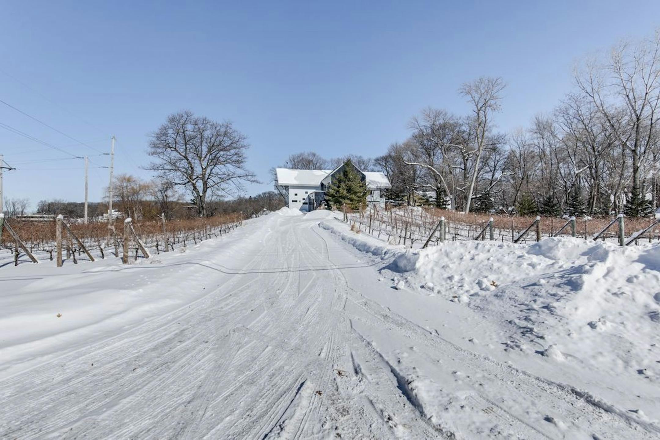 The home is set on 2 acres just four blocks from downtown Wayzata's upscale restaurants and shops.