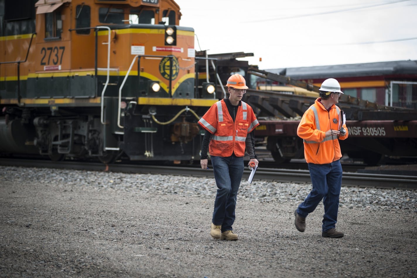 Rail workers at the scene of a fatal incident involving a train at BNSF Railway on Harrison St. in Minneapolis, Minn. on Monday, May 25, 2015.