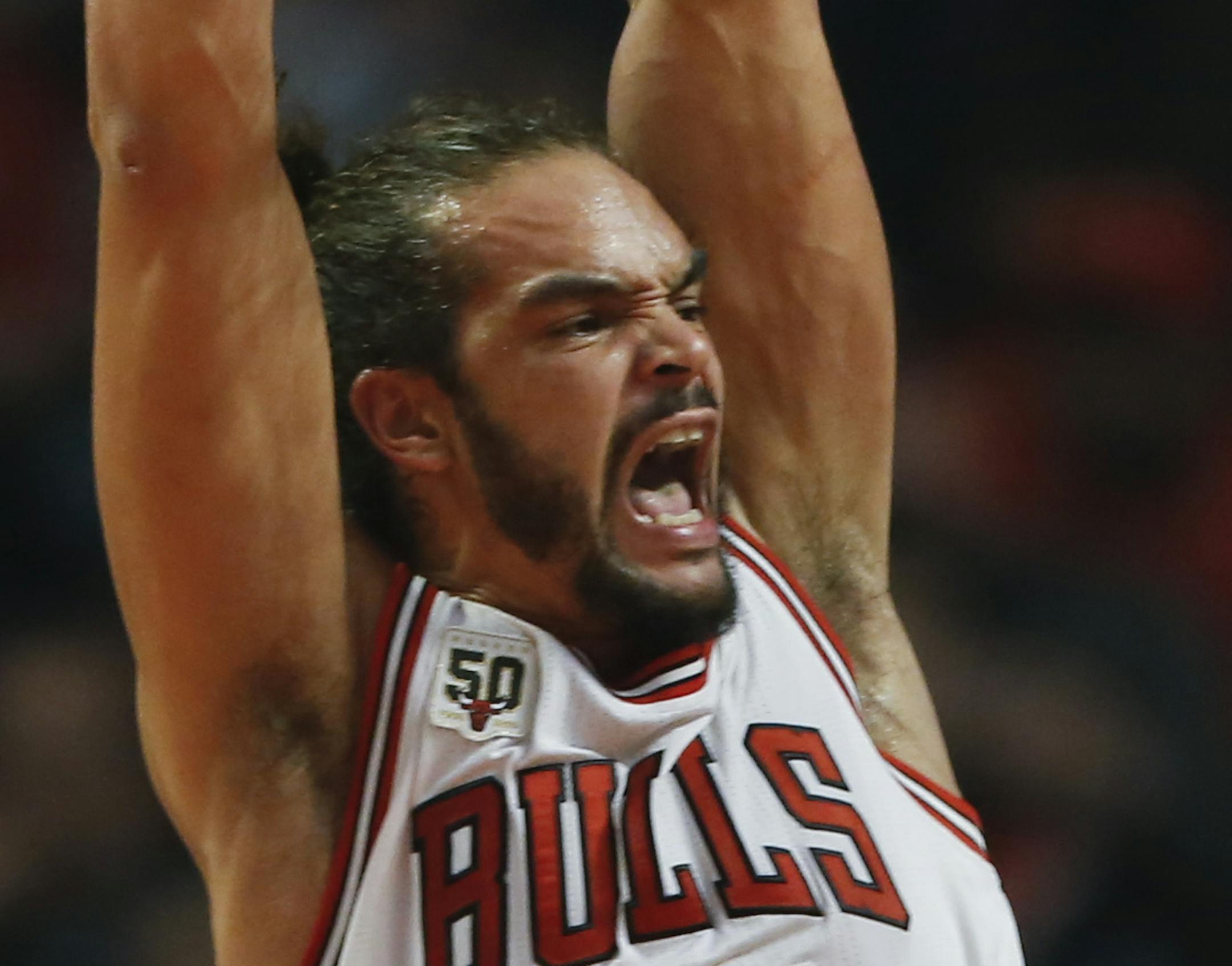 Chicago Bulls center Joakim Noah, reacts after scoring against the Orlando Magic, during the first half of an NBA basketball game, Sunday, Nov. 1, 2015, in Chicago. (AP Photo/Kamil Krzaczynski) ORG XMIT: CXA139