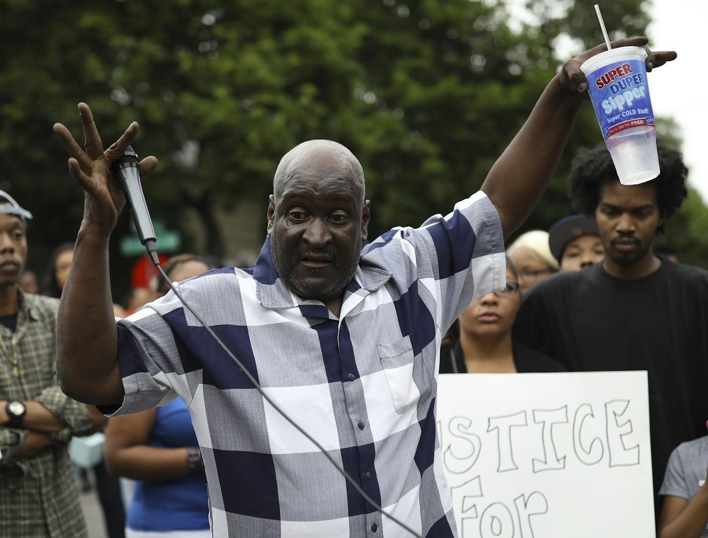 James Lark, who said he witnessed the confrontation between police and Thurman Blevins, told the crowd how Blevins raised his arms and told police he didn't have anything. ] JEFF WHEELER &#xef; jeff.wheeler@startribune.com Community members gathered at the intersection of 47th and and Camden Ave. N. to remember Thurman Blevins Sunday evening, June 24, 2018 in Minneapolis.