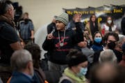 Little Earth resident Nicole Mason talks about her grandchild with severe asthma during a heated community meeting with the MPCA and the EPA about the