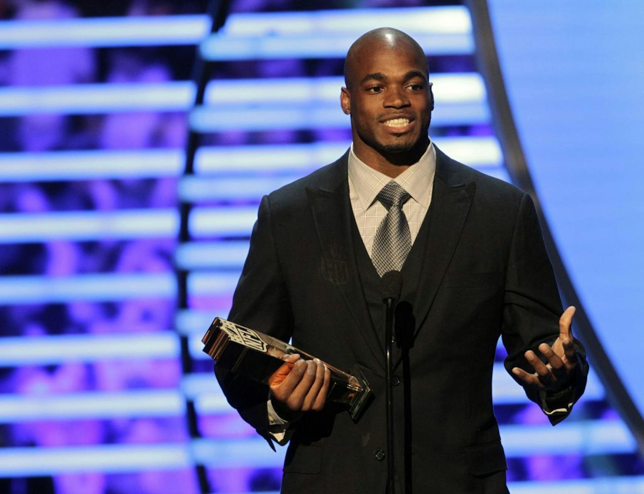 Adrian Peterson of the Minnesota Vikings accepts the NFL.com Fantasy Player of the Year award at the 2nd Annual NFL Honors on Saturday, Feb. 2, 2013 in New Orleans.