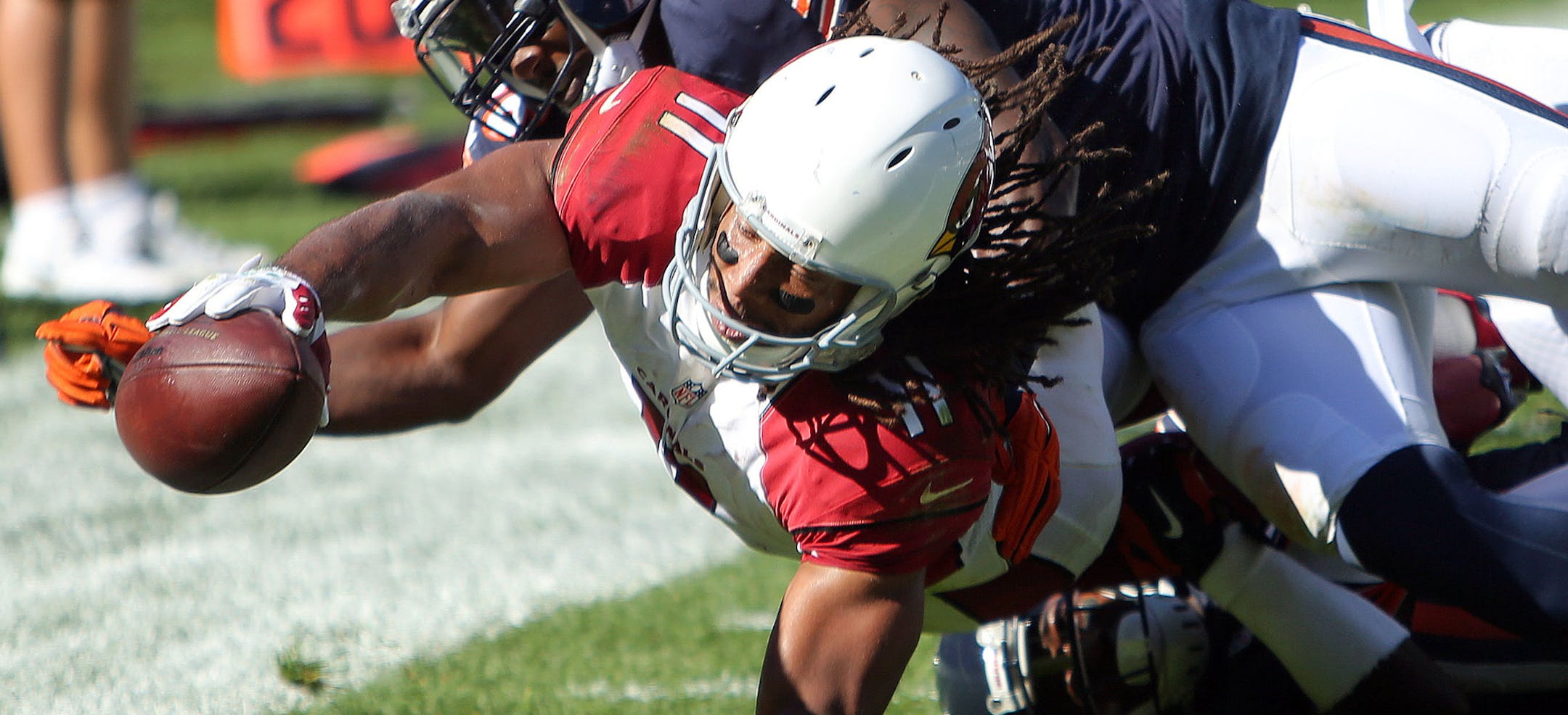 Arizona Cardinals wide receiver Larry Fitzgerald drags Chicago Bears cornerback Terrance Mitchell into the end zone during an NFL football game, Sunday, Sept. 20, 2015 in Chicago. (Steve Lundy/Daily Herald via AP) MANDATORY CREDIT; MAGS OUT