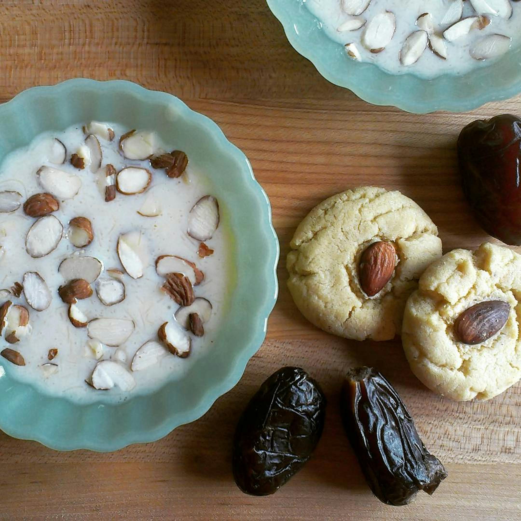 The author's mother prepared this helping of sheer-kurma, a milky soup with hyderabadi vermicelli served only on Eid. The confection is paired with a nan khatai biscuits and medjools.