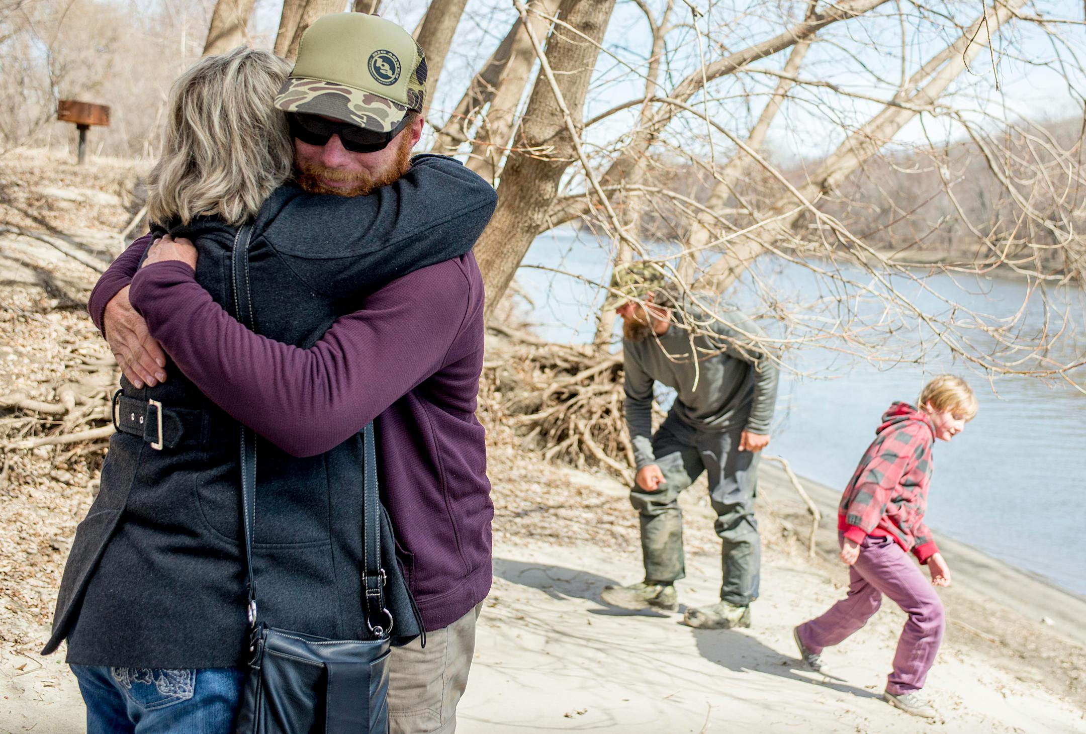Adam Trigg hugged his mother Diane after arriving at Fort Snelling State Park. She hadn't seen her son since Jan. 2, when she saw the group depart from Louisiana.