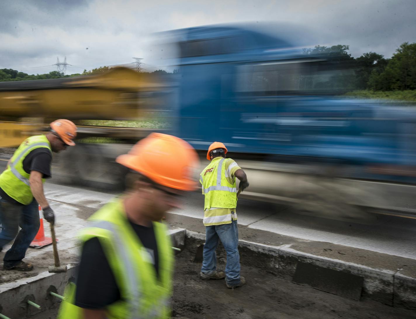 Construction workers Nick Norman, Joe Olson and Eldio Ferreira worked on a lane of Highway 55 in Inver Grove Heights, Minn. as trucks and cars flew past in the adjoining lane. Starting Aug. 1, the current "Fines Double in Work Zones" standard will be replaced by clearer ones, reading "$300 minimum fines." ] REN&#xc9;E JONES SCHNEIDER &#x2022; reneejones@startribune.com