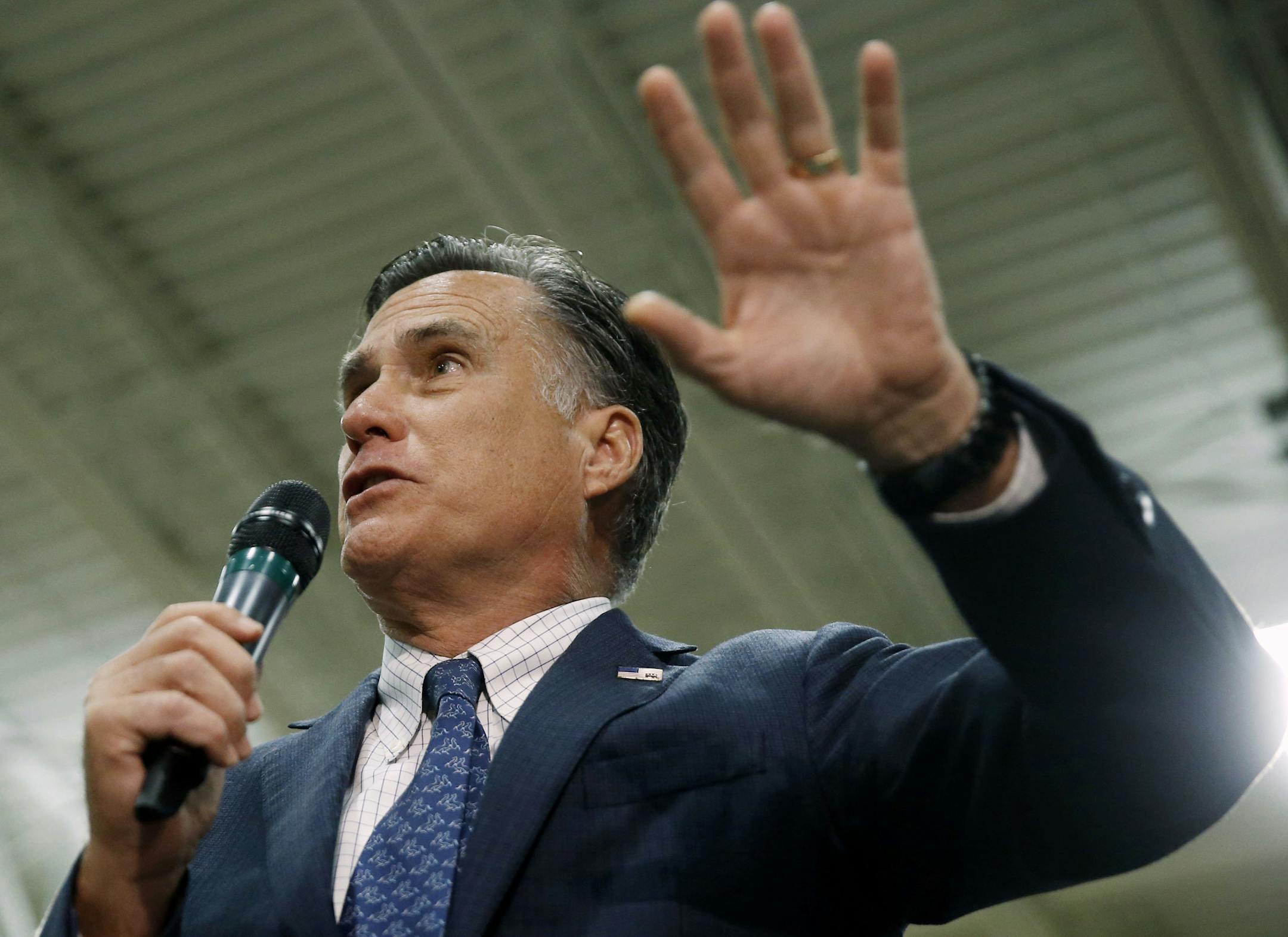 Former Republican presidential candidate Mitt Romney speaks at a Republican presidential candidate, Ohio Gov. John Kasich campaign stop on Monday, March 14, 2016, at Westerville Central High School in Westerville, Ohio. (AP Photo/Matt Rourke)