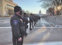 Deputies from the Anoka County Sheriff’s Office stood on watch on Pennsylvania Avenue during the inauguration Jan. 20, 2021 in Washington.