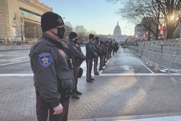 Deputies from the Anoka County Sheriff’s Office stood on watch on Pennsylvania Avenue during the inauguration Jan. 20, 2021 in Washington.