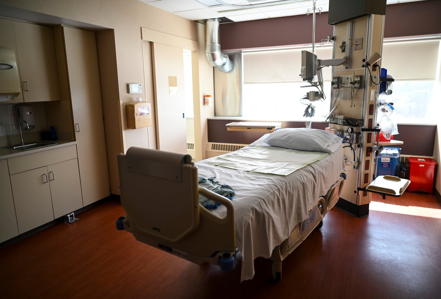 An empty bed at North Memorial Health Hospital in Robbinsdale in March 2021.