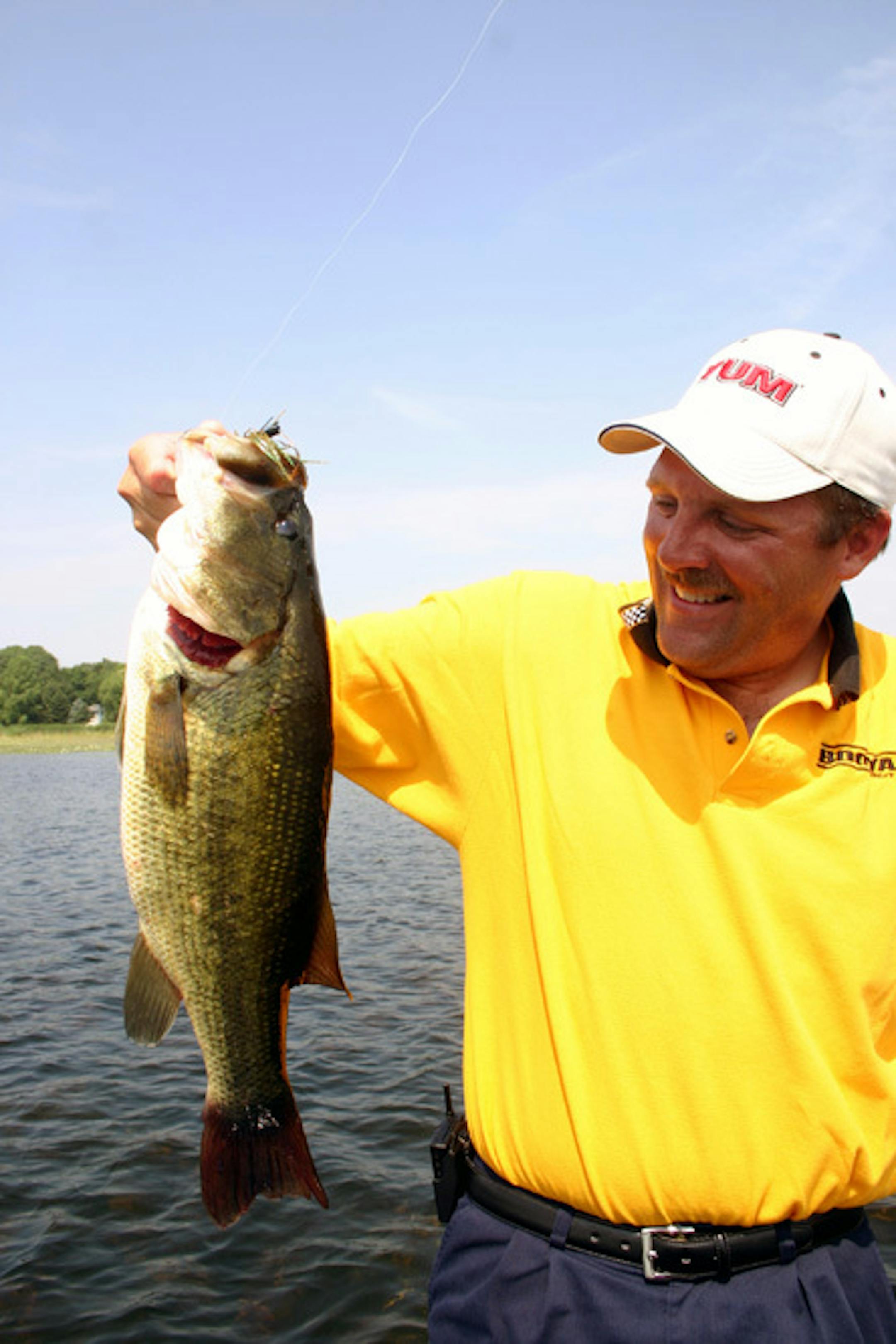 Tom Braaten with a six-pound largemouth bass from a lake known for "producing lots of small bass"