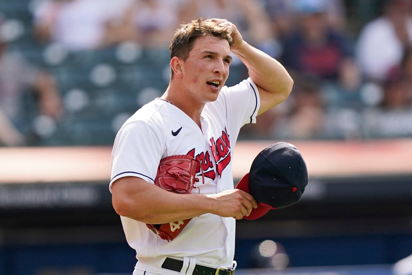 Cleveland Indians relief pitcher James Karinchak reacts after giving up a three-run home run to Minnesota Twins' Kyle Garlick in the tenth inning of a baseball game, Sunday, May 23, 2021, in Cleveland. (AP Photo/Tony Dejak)