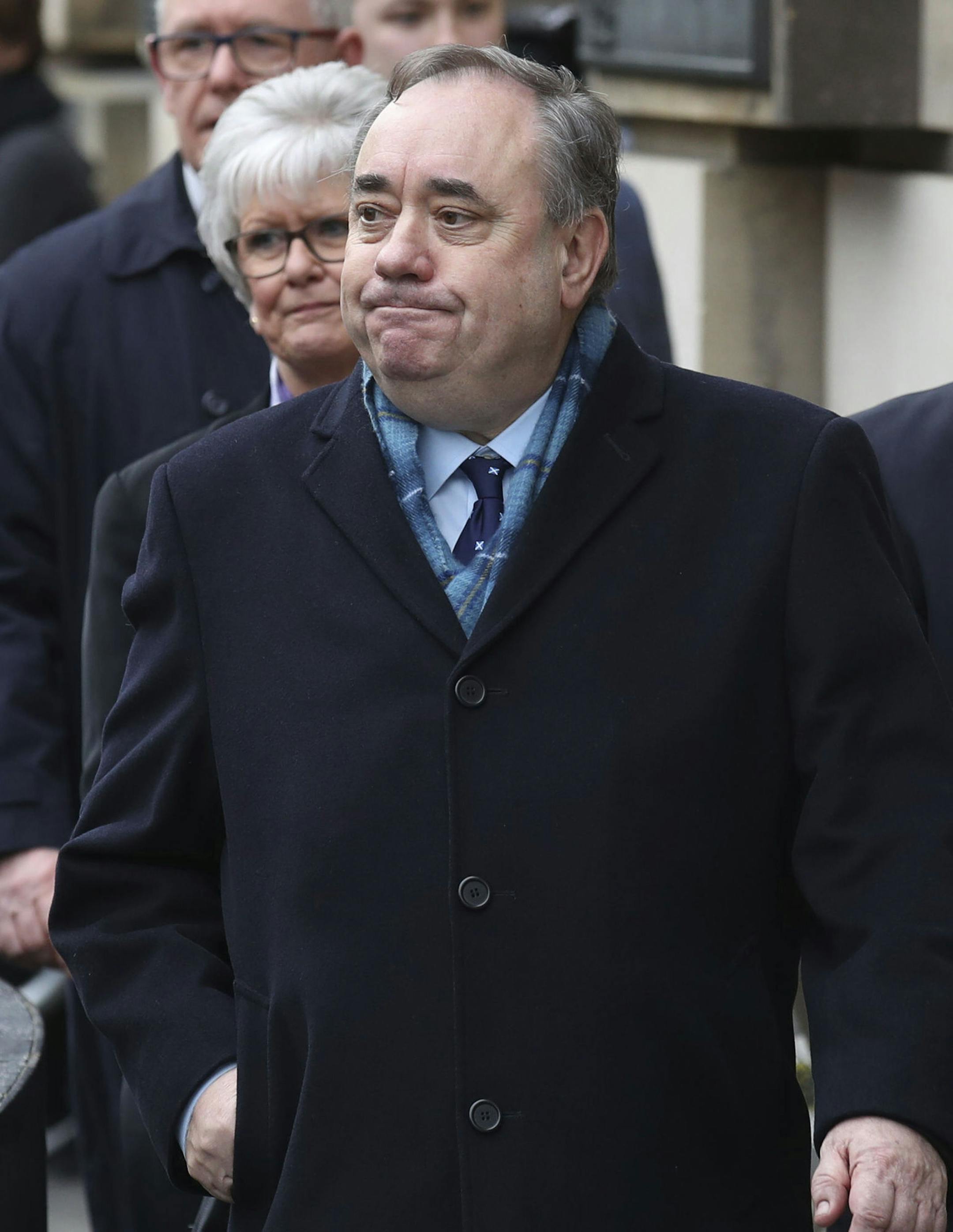 Alex Salmond leaves the High Court after he was cleared of attempted rape and a series of sexual assaults, including one with intent to rape, against nine women, who were all either working for the Scottish Government or within the SNP at the time, in Edinburgh, Monday March 23, 2020. (Jane Barlow/PA via AP)