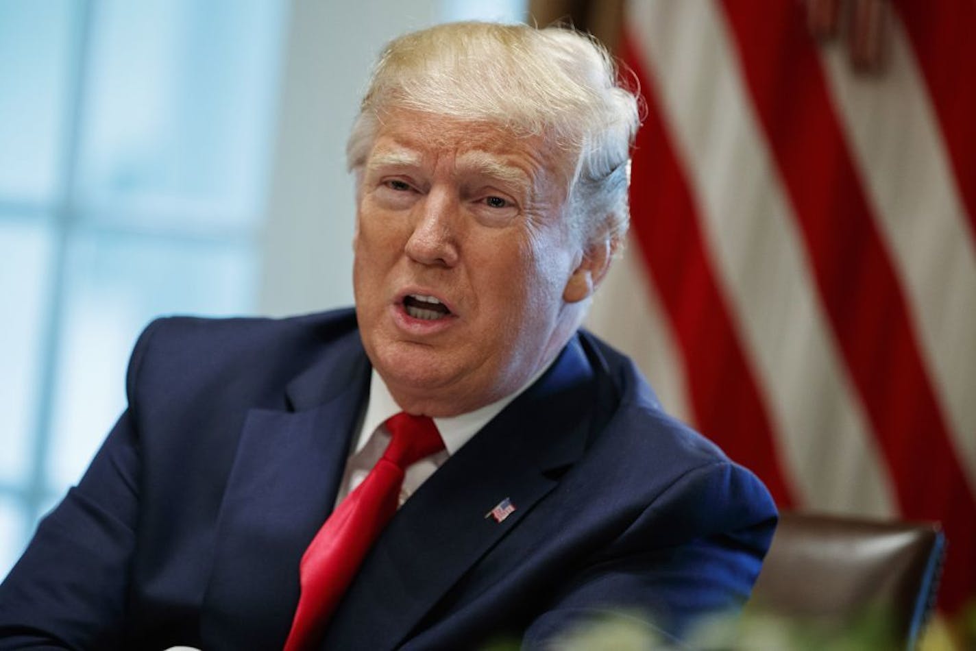 President Donald Trump speaks on June 13 during a meeting in the Cabinet Room of the White House, in Washington. In a tweet late Monday, June 17, 2019, Trump said that U.S. Immigration and Customs Enforcement will begin removing millions of people who are in the country illegally.