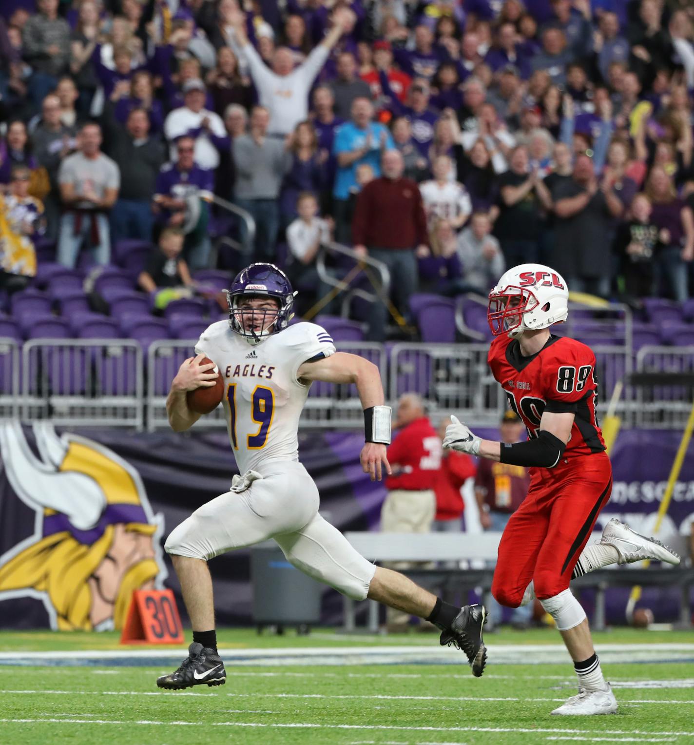 Rochester Lourdes quarterback Noah Hillman scrambled for a touchdown in the fourth quarter. ] Shari L. Gross / sgross@startribune.com Rochester Lourdes defeated St. Croix Lutheran 42-35 in the 3A football championship at U.S. Bank Stadium in Minneapolis, Minn. on Saturday, Nov. 26, 2016.