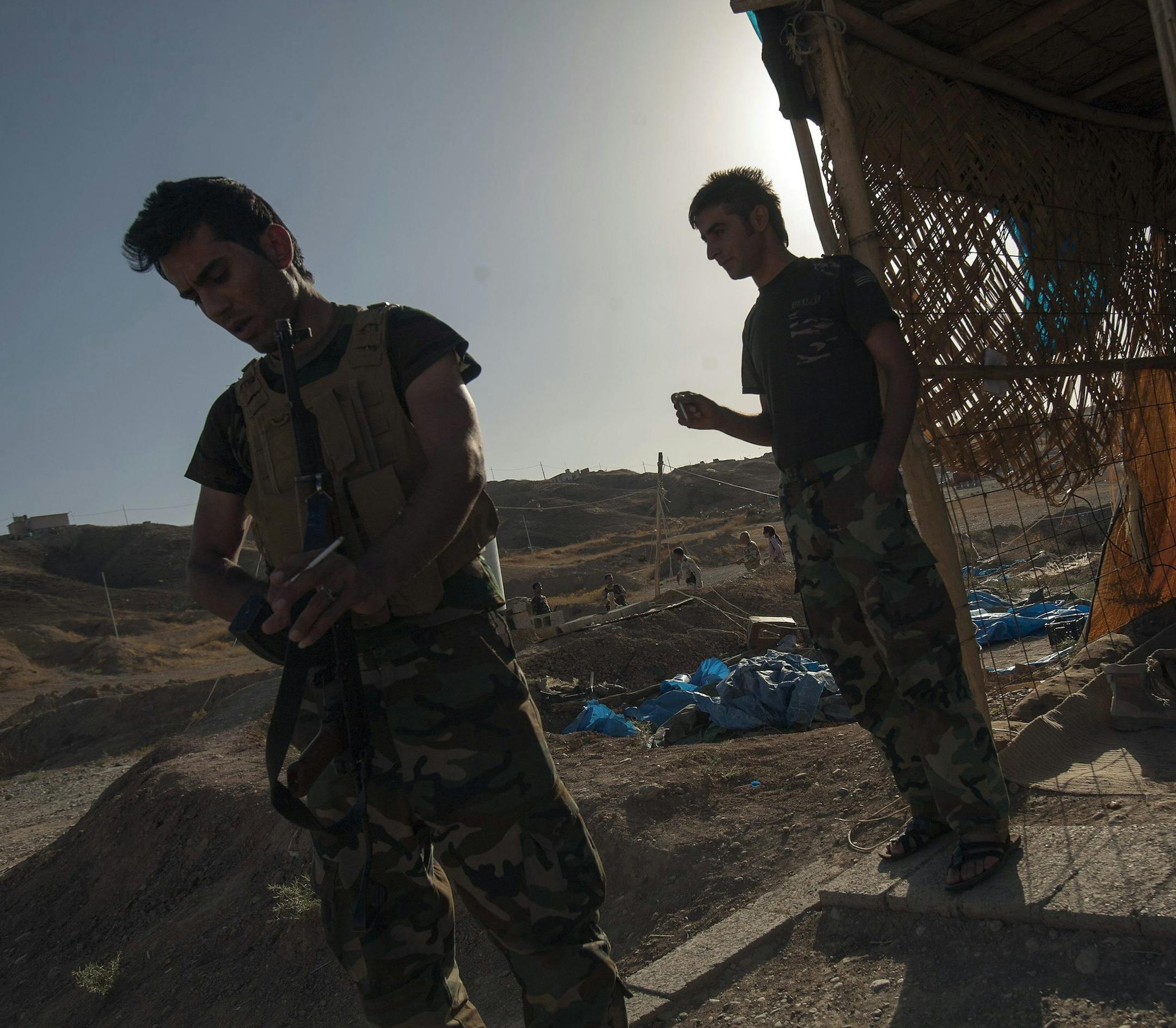 Kurdish Peshmerga fighters along a frontline position protect the main highway between Kurdish occupied Kirkuk and the capital of the Kurdish Regional Government in Irbil. (Michell Prothero/MCT)