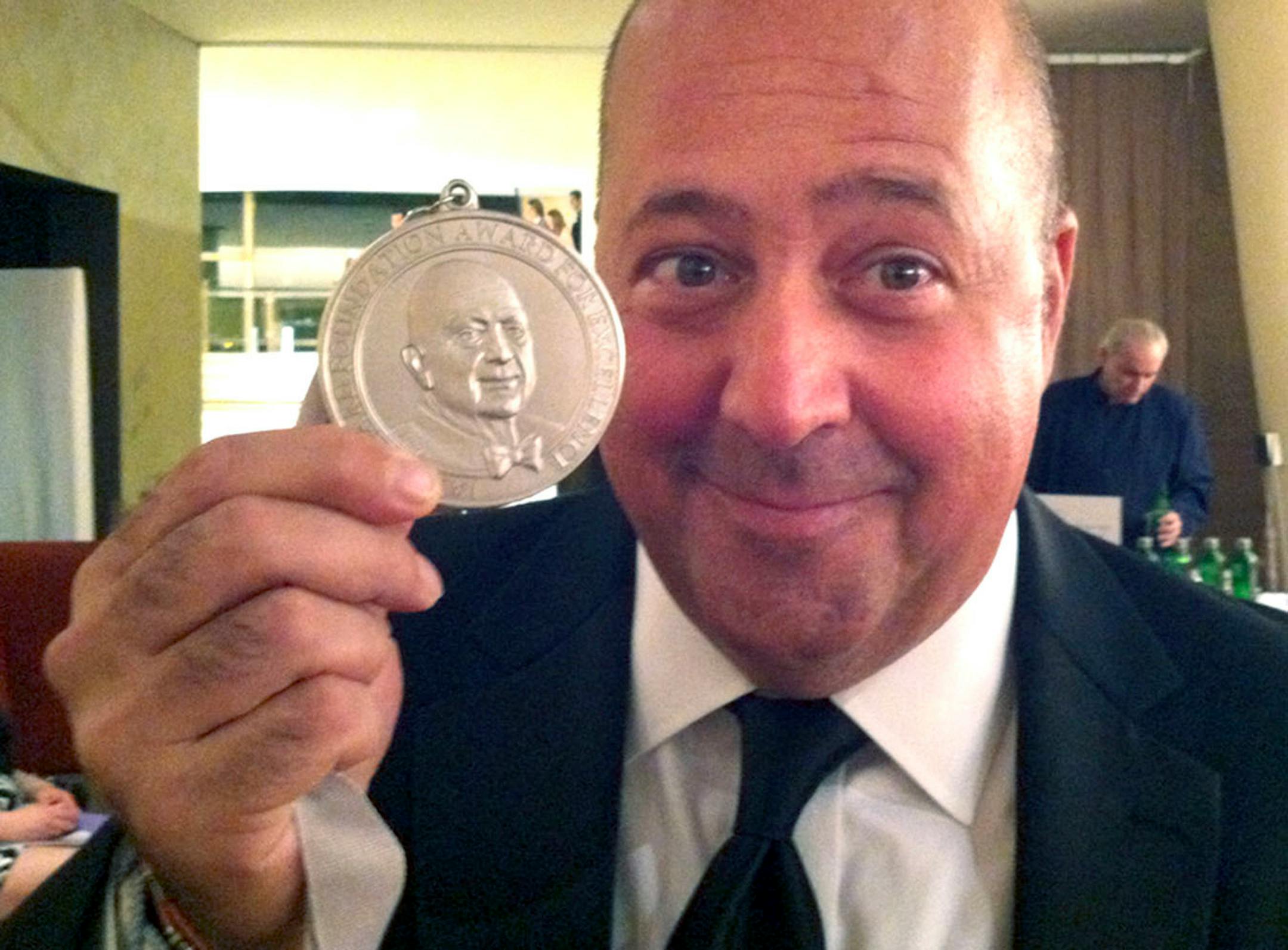 Andrew Zimmern with his James Beard Award.